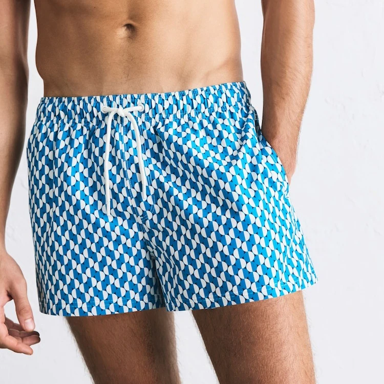 Pantaloncini da bagno da 4 pollici in mesh 100% poliestere con stampa sublimatica con logo personalizzato, ad asciugatura rapida