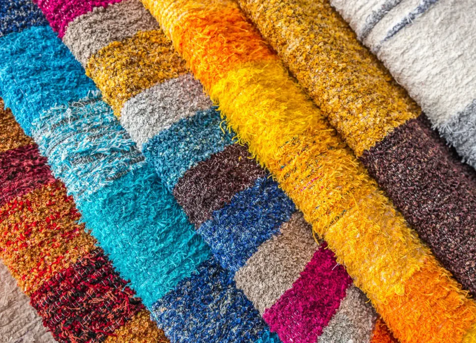 Fabric swatches showing colours and textures considered during garment development