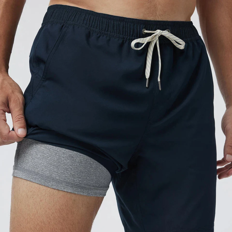 Dark training shorts with drawcord waistband and visible inner liner