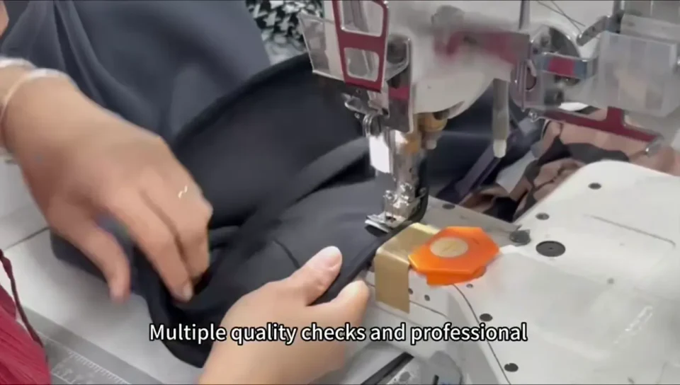 Garment sewing shown in the Yumulin factory tour video
